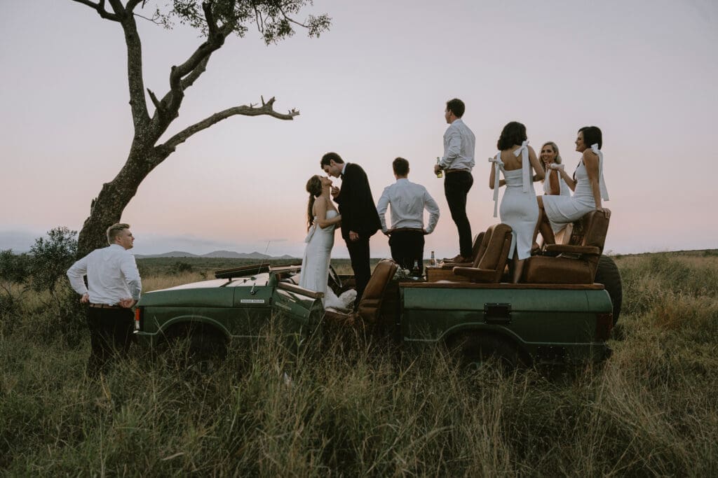 Bridal party on game viewing vehicle during creative shoot