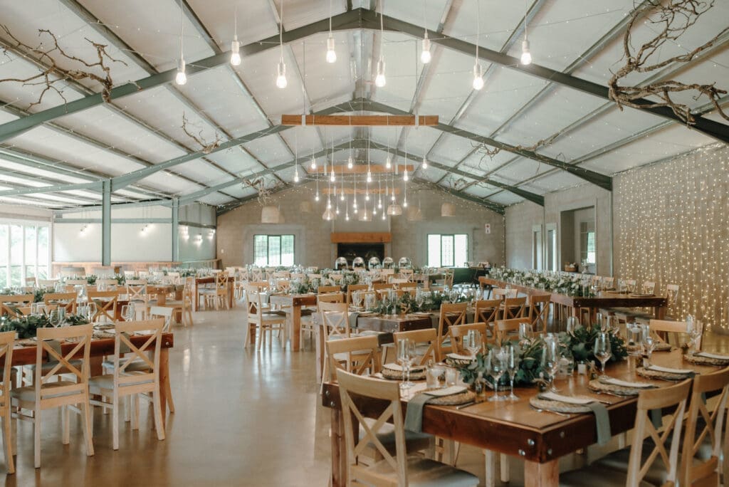 Reception venue with beautifully decorated tables.