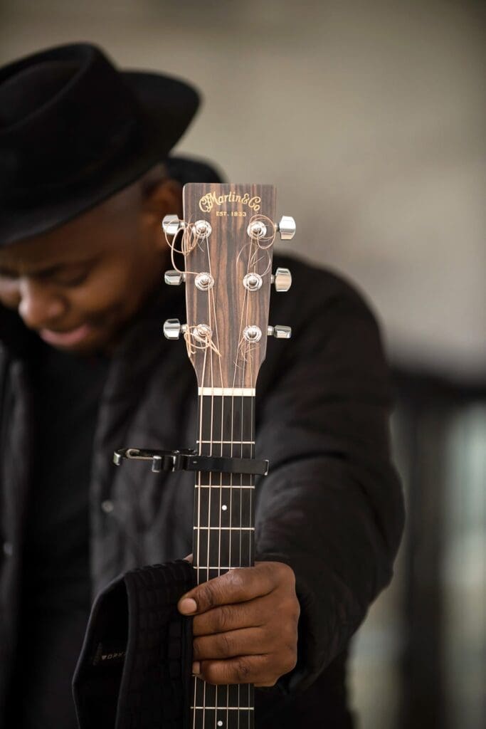 Musician holding guitar