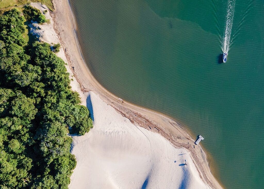 Brid's eye view photo of boat crossing lagoon at Umngazi Hotel & Spa