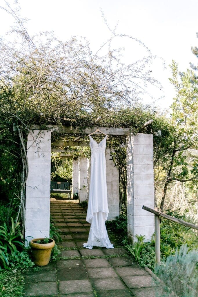 Talloula-Country-Wedding-Venue-KZN Wedding dress hanging up in pretty garden