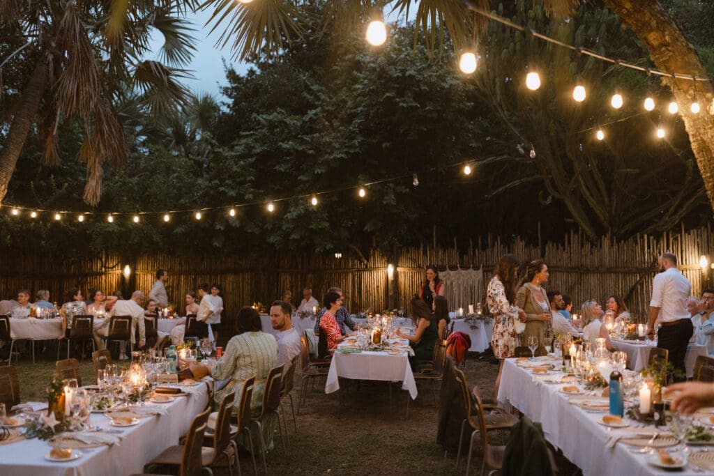 Boma set up with string lights for evening wedding reception