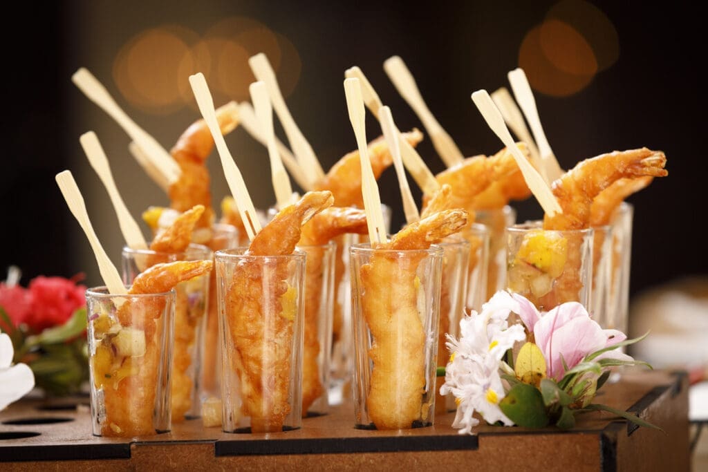 Crumbed prawns served in shot glasses - prepared by Hamblin's Catering