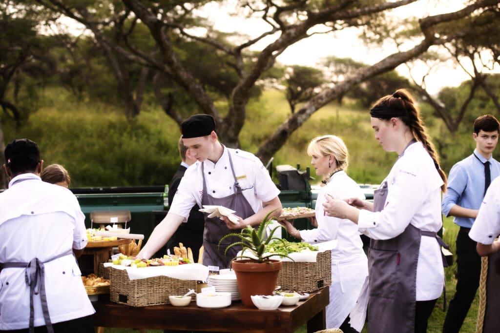 Chef Jackie Cameron and her team of student chefs setting up for a wedding