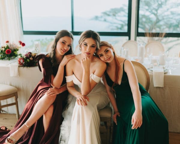 Bride and bridesmaids wearing dresses from A'mour Bridal Boutique