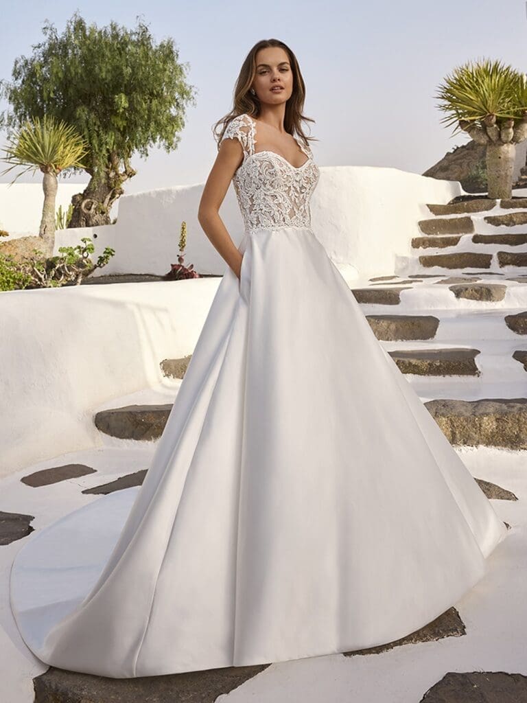 Cap sleeved ballgown wedding dress with lace bodice and plain skirt