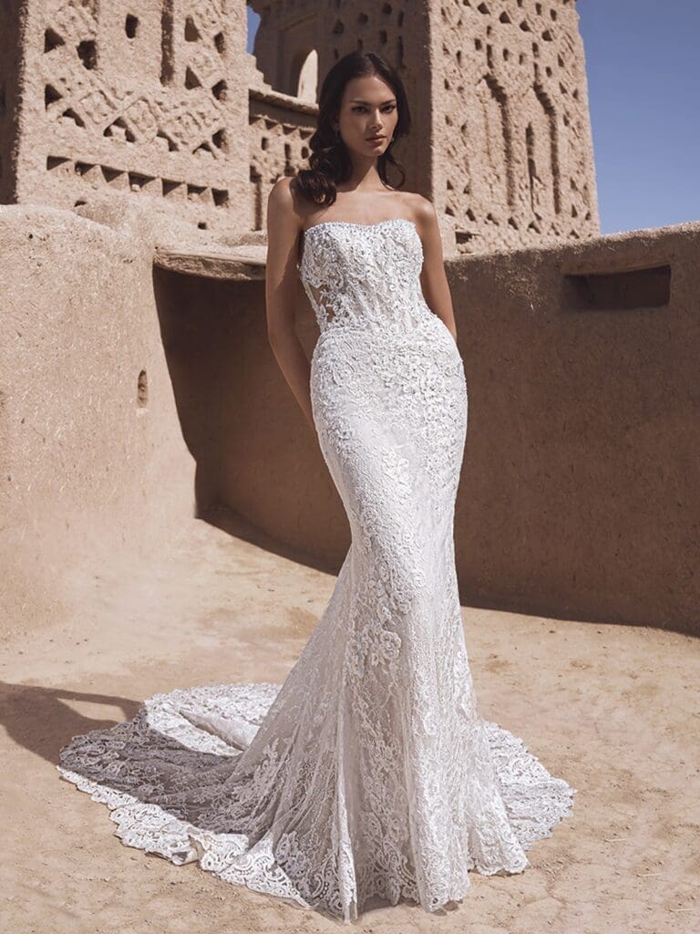 Strapless and tight fitted wedding gown with heavy lace detailing
