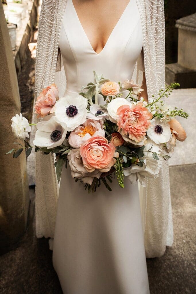 Anemones and peach blooms steal the show in this romantic bridal bouquet by Stephanie Roseanne Design