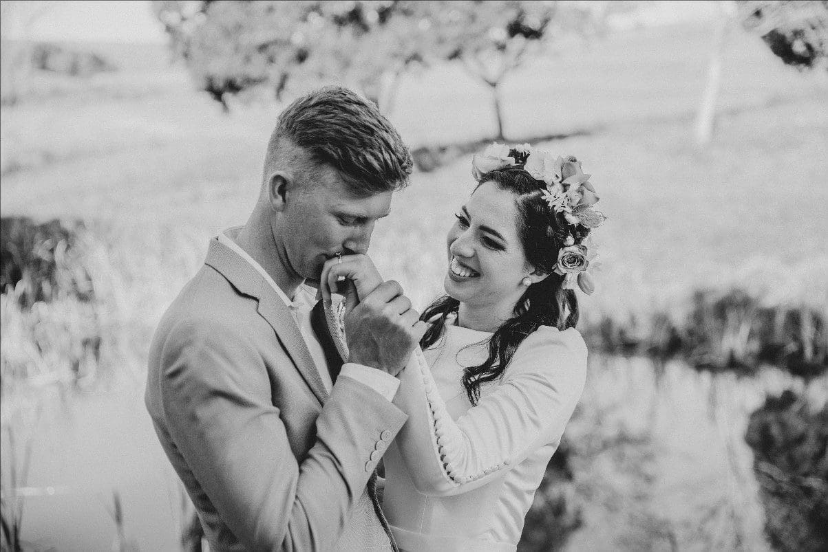 Couple creative shoot hand kissing pose