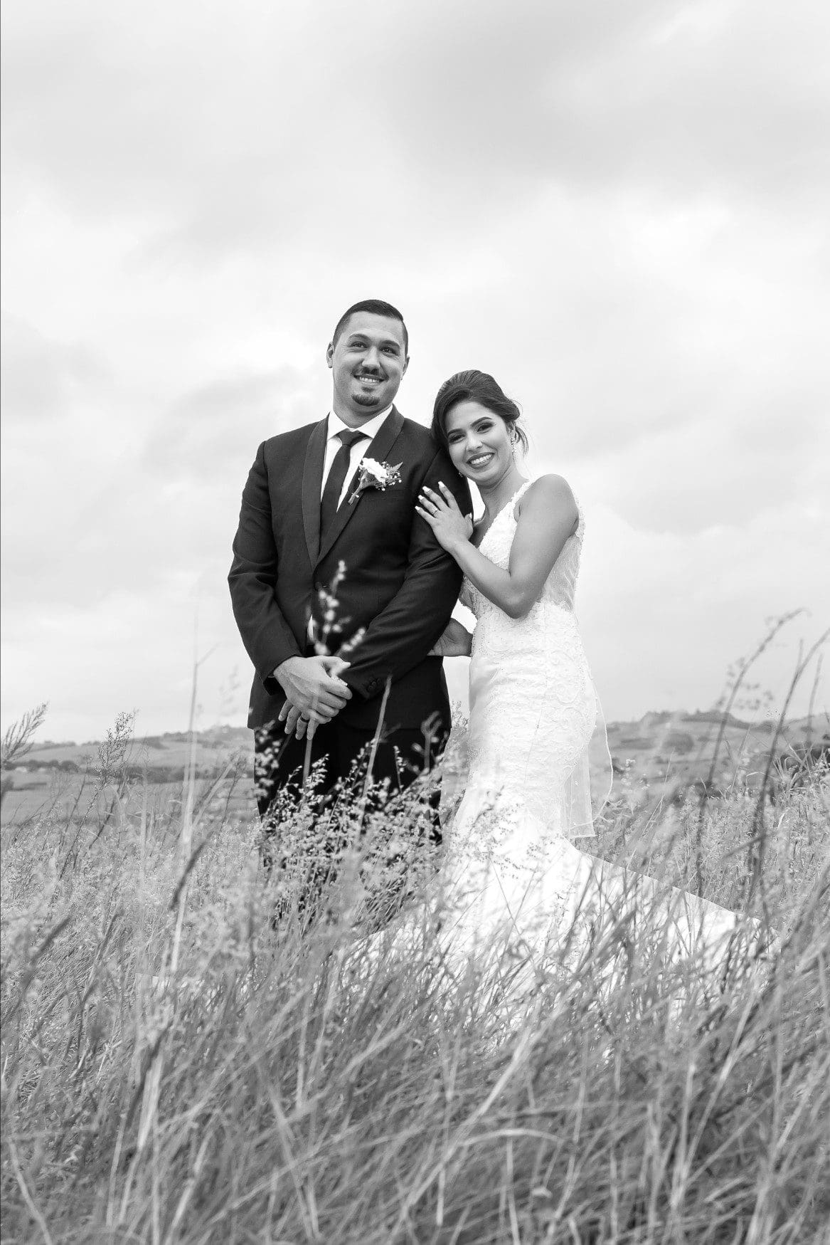 Bride laying her head on her husband's shoulder