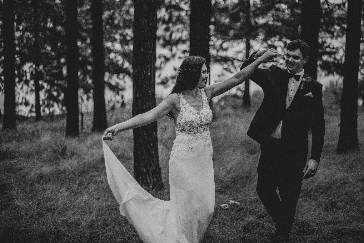 Bride twirling in forest