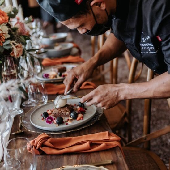 Catering team plating food