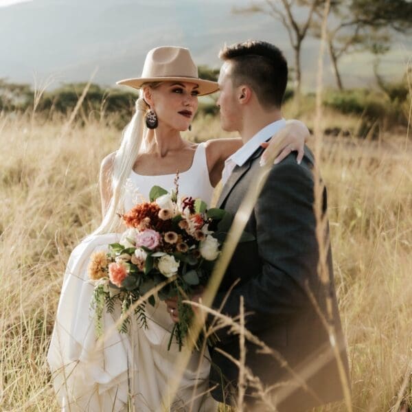 bridal couple in long grass