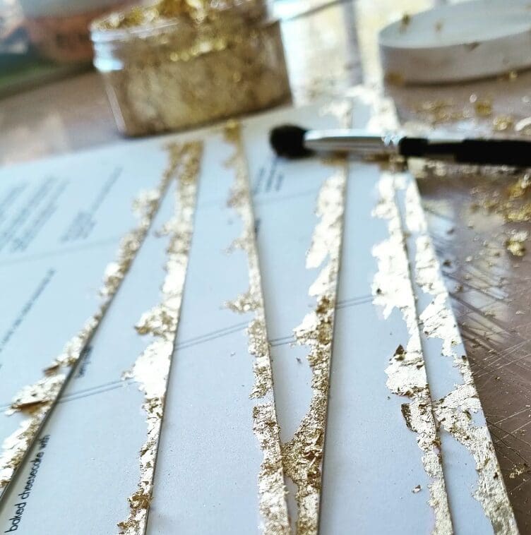 Gold leaf edges on wedding menus