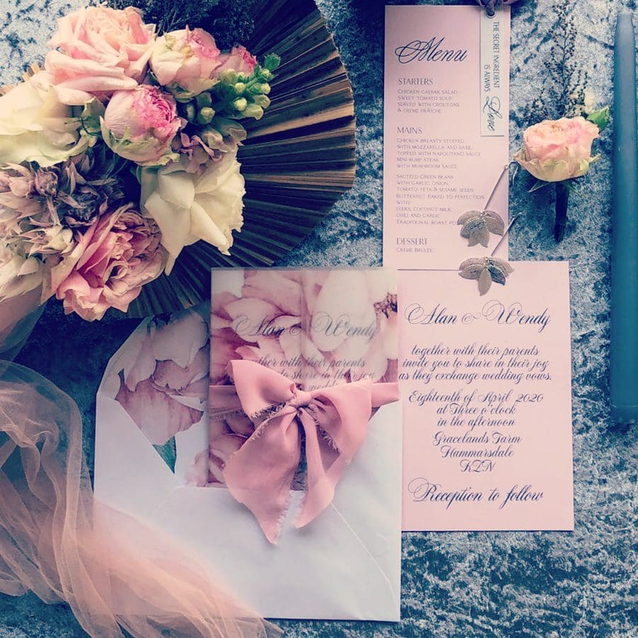 Floral envelope liner and vellum overlay on invite