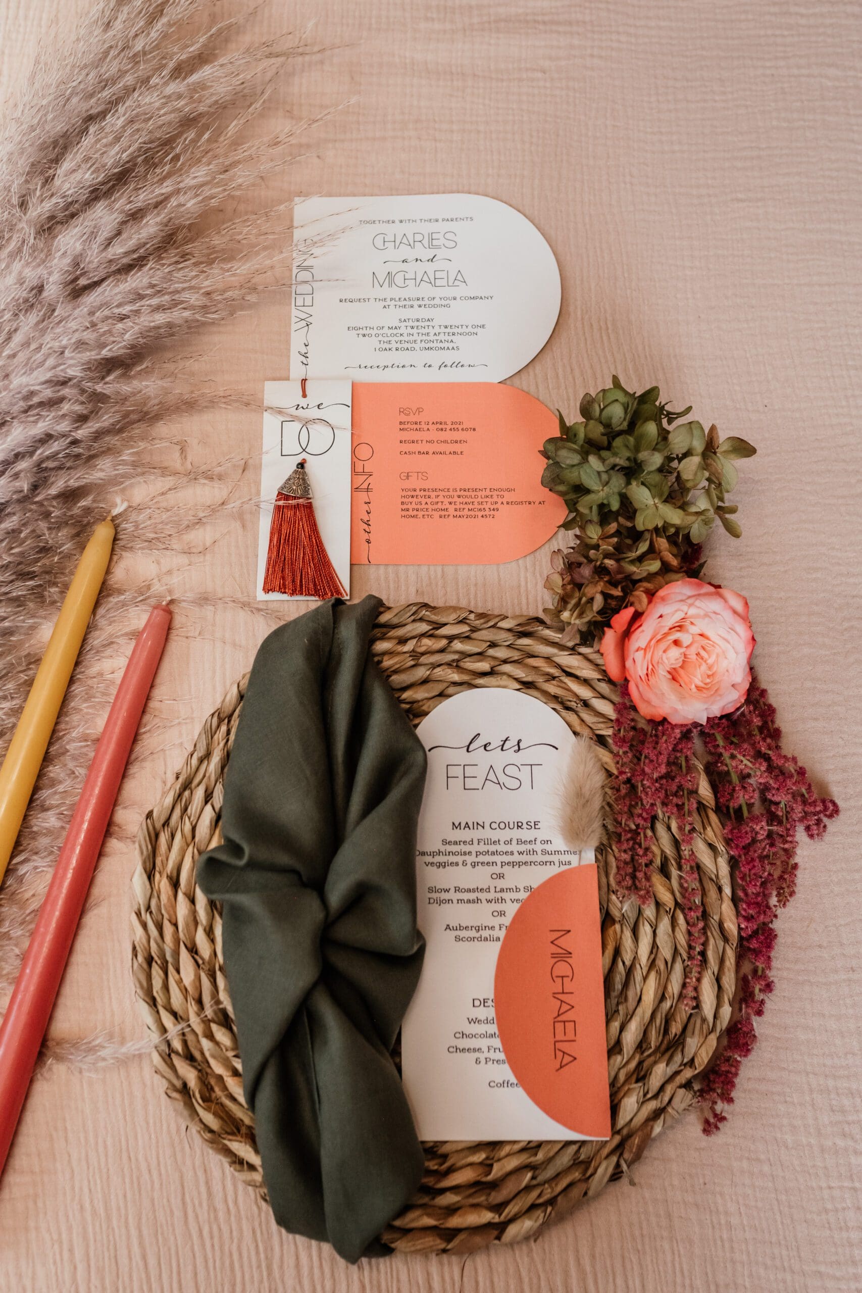 curved cut out wedding stationery on placemat with napkin