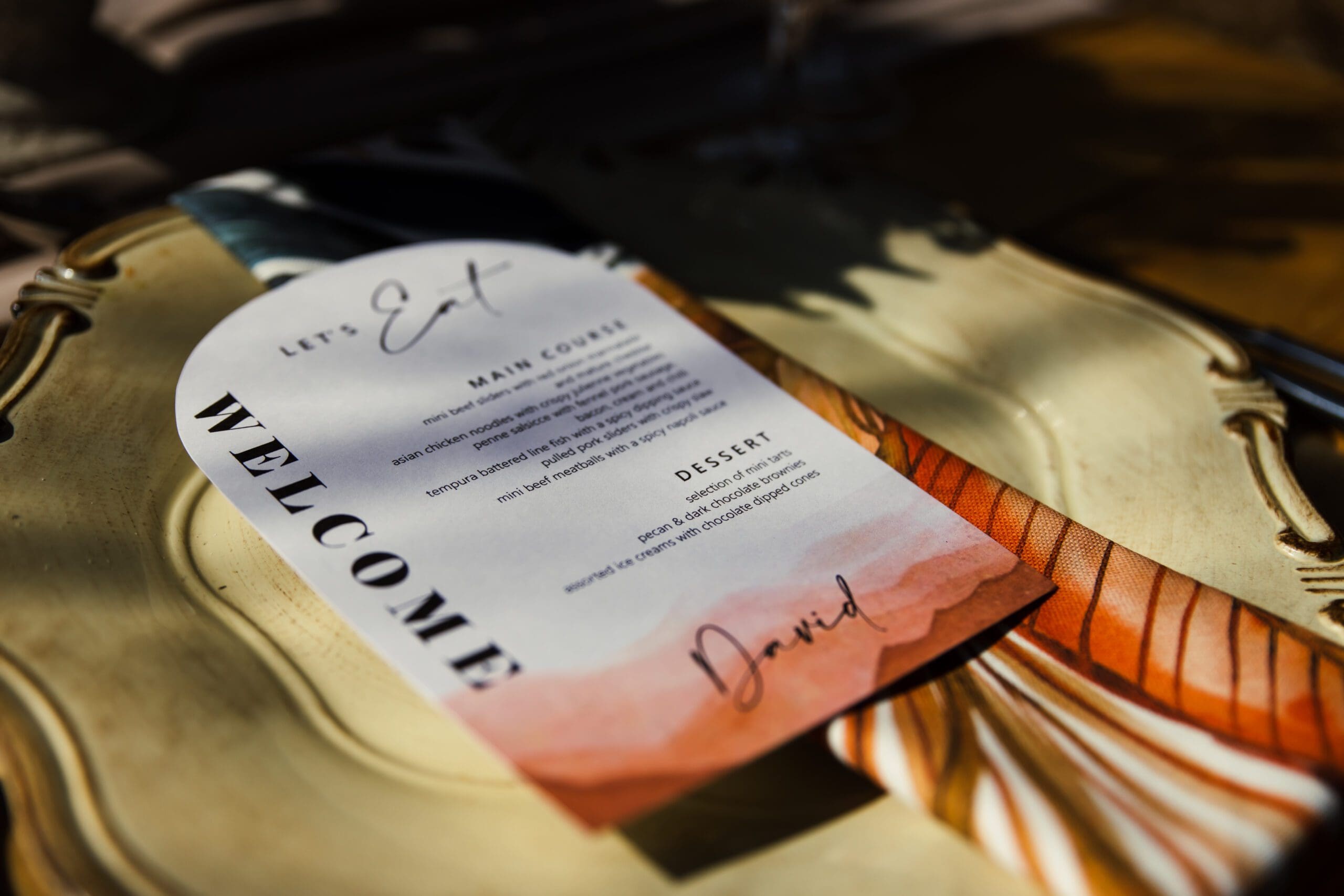 arched wedding menu on side plate