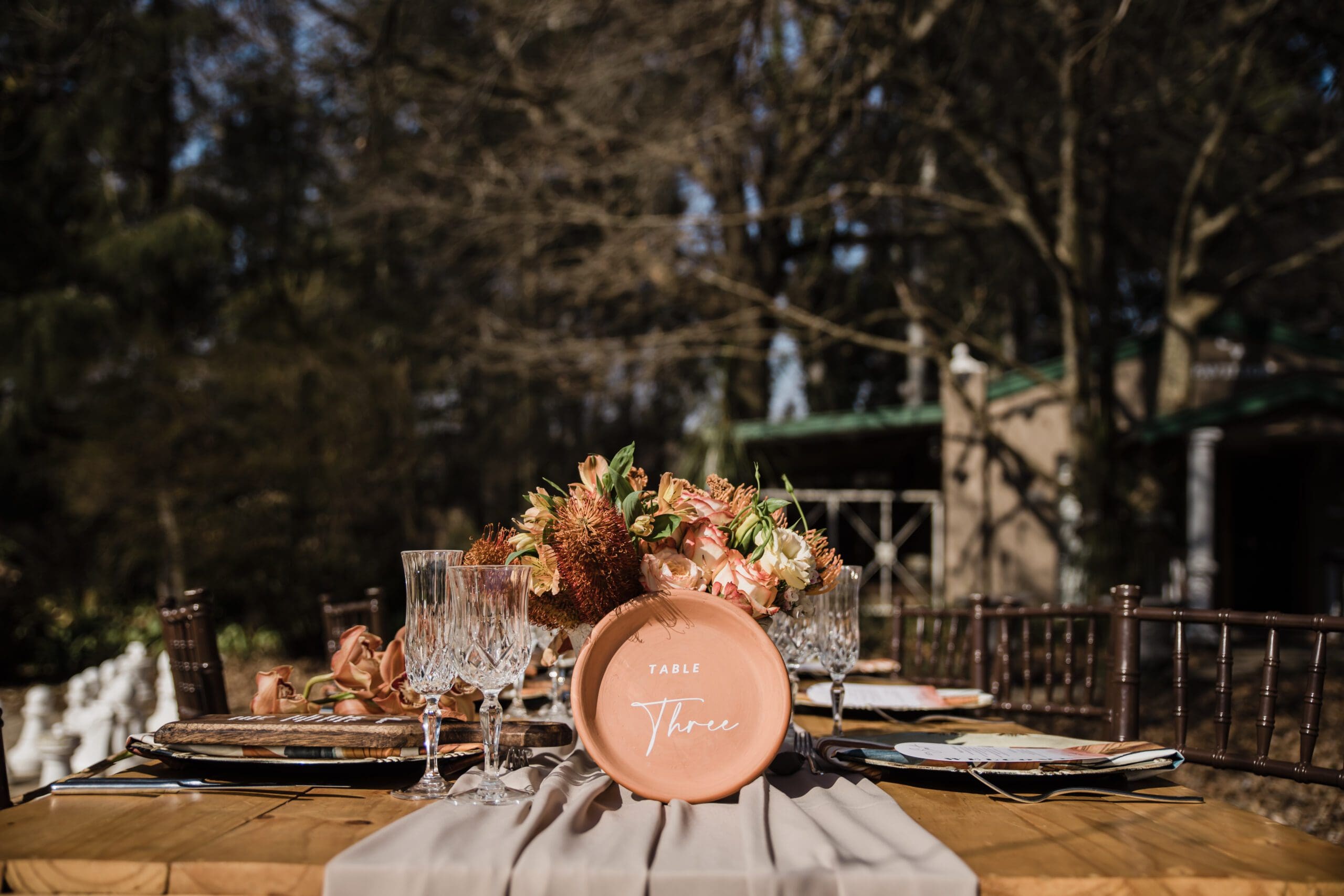 Vinyl on terracotta plate as a table number