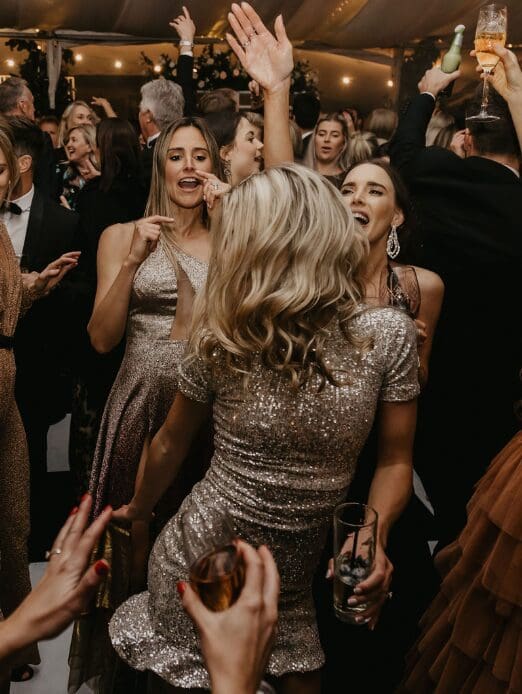 Bride dancing in golden reception dress