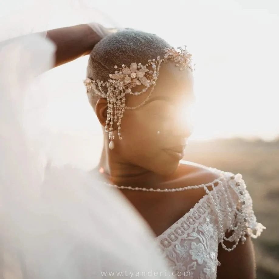 Bride wearing pearl head piece
