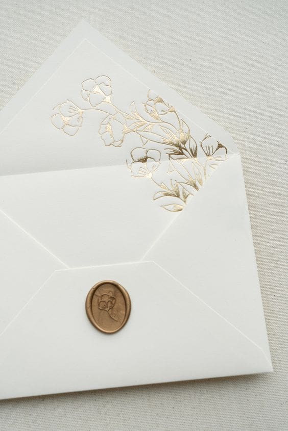 White envelope with gold liner and gold wax seal - by Papira