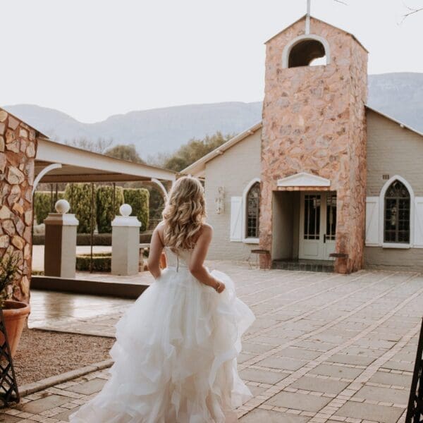 Bride walking towards chapel