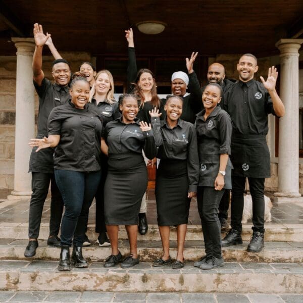 Service Excellence catering team dressed in black uniforms