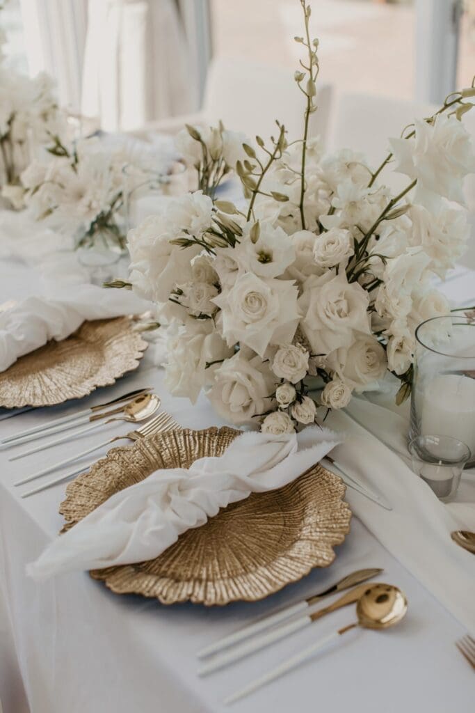Sophisticated monochromatic white wedding table decor