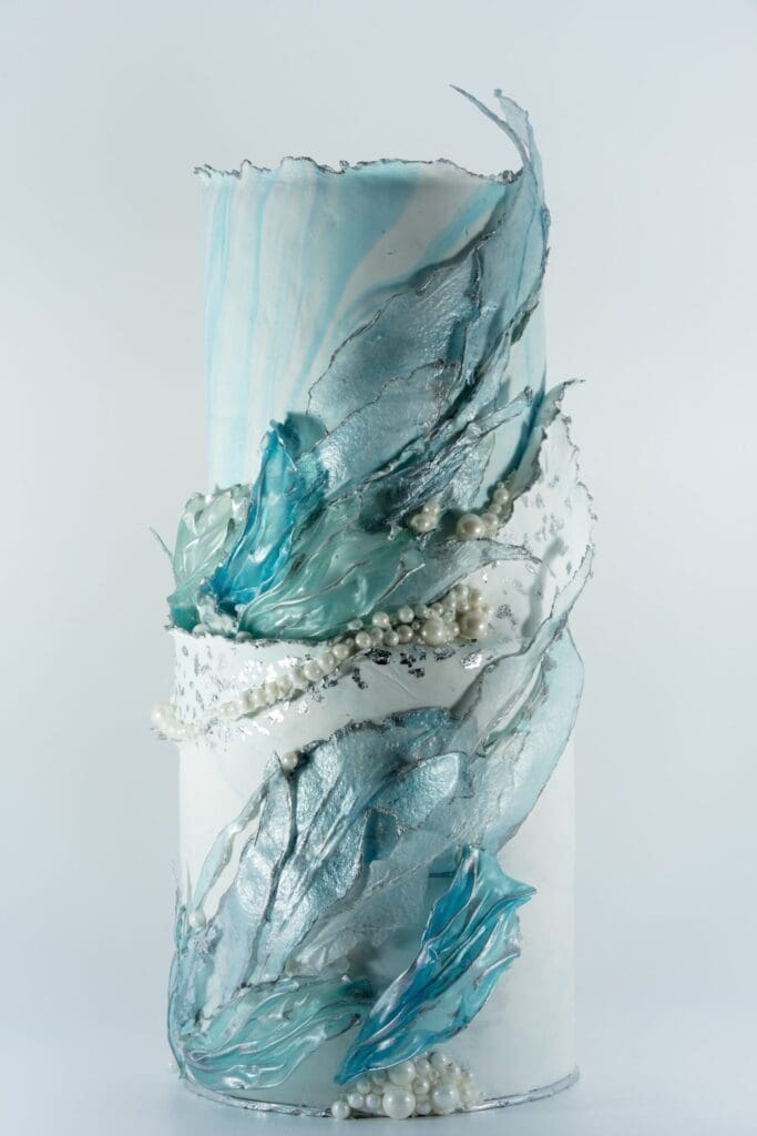 Two tired wispy blue marbled wedding cake