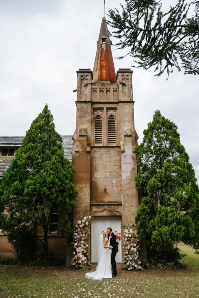 Conway-Photo-and-Film-Newlyweds-outside-chapel-scaled
