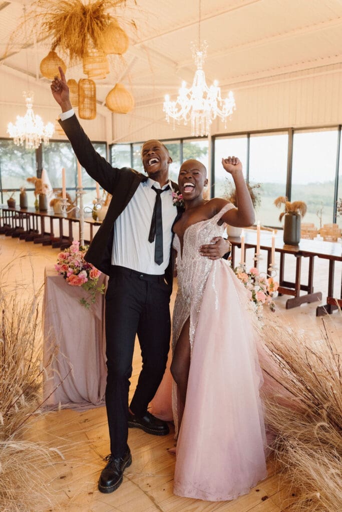 Bride and groom in cheer in their beautiful reception venue.
