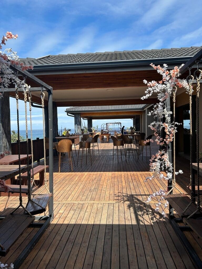 View of covered wooden deck area at The Lazy Moose