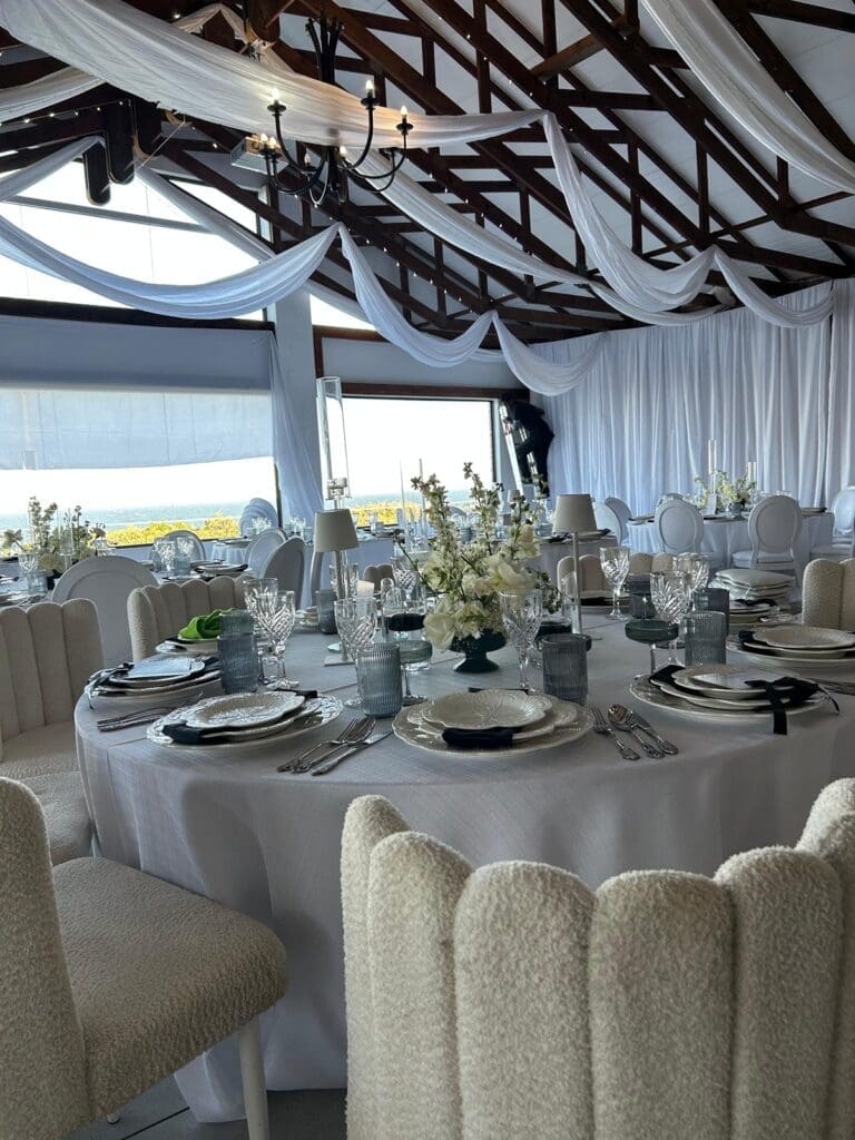 All white table decor for a wedding at The Lazy Moose