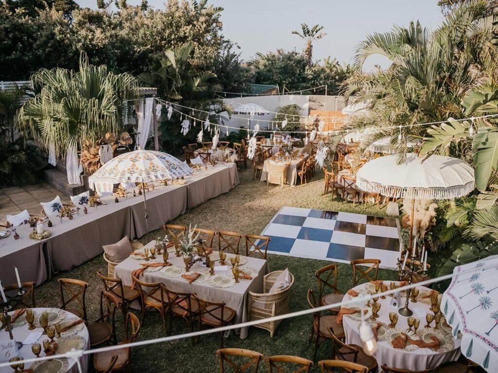 Outdoor furniture setup for beach reception at Baron Beach House