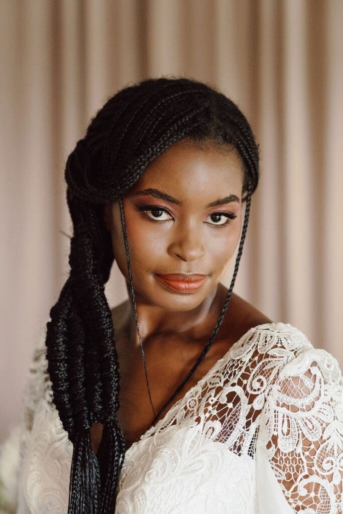 African bride with long braided hairstyle