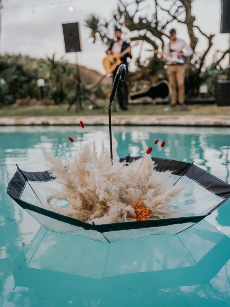 Umbrella floating in pool at Baron Beach House