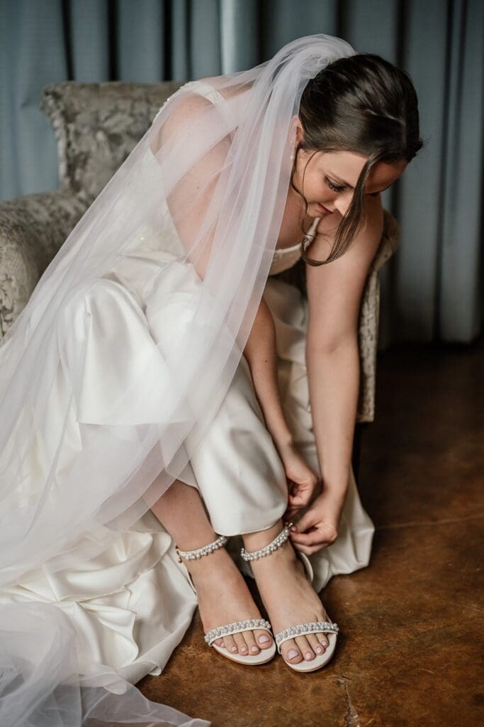 Bride slipping on her shoes