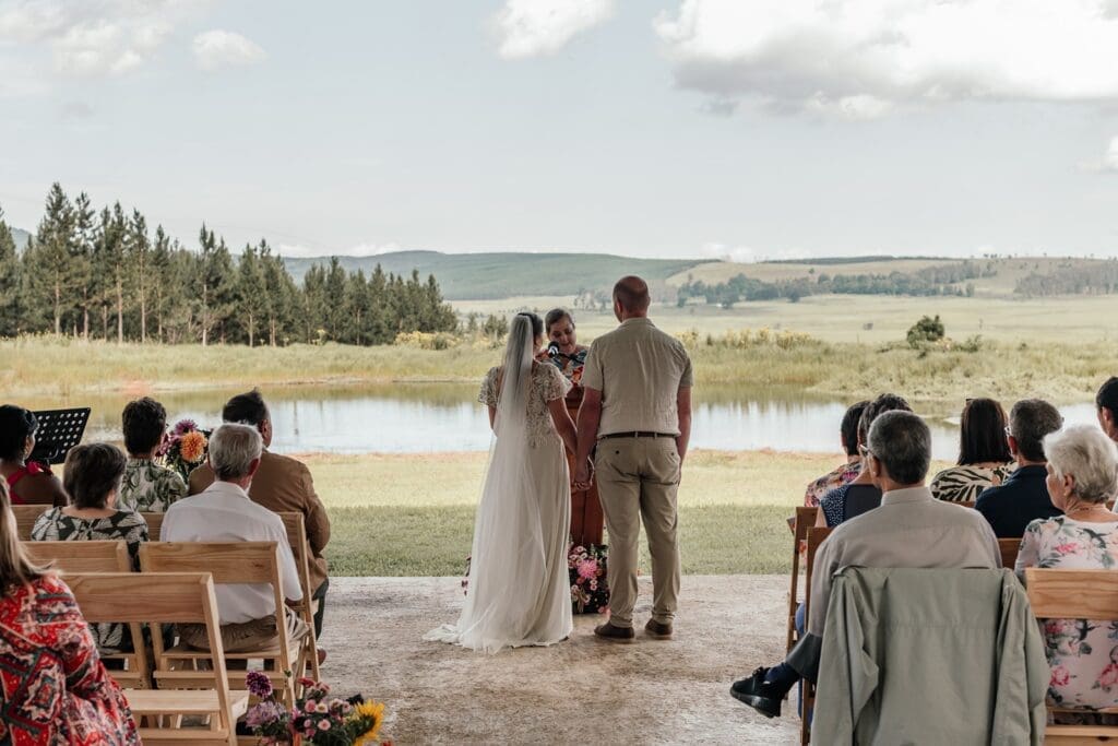 Bride and groom standing together during ceremony