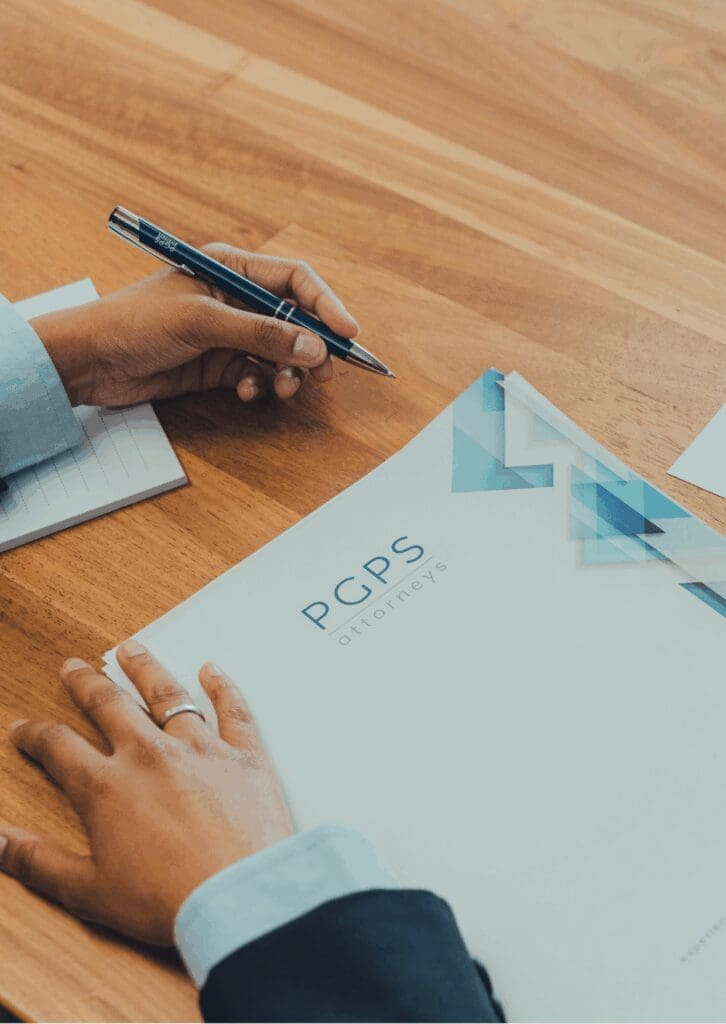 Legal documentation from PGPS Attorneys being signed