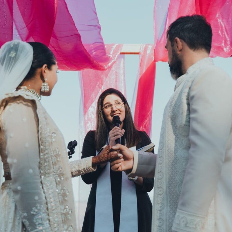 Rev. Alice officiating wedding ceremony at Indian Wedding