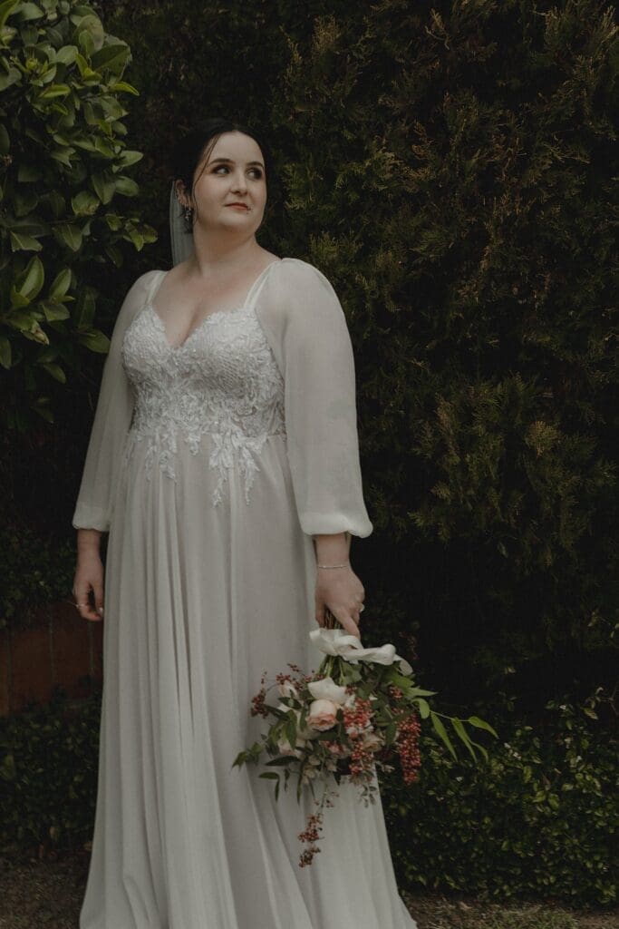 A-line wedding gown with sheer sleeves and beaded bodice by Meliza Mary