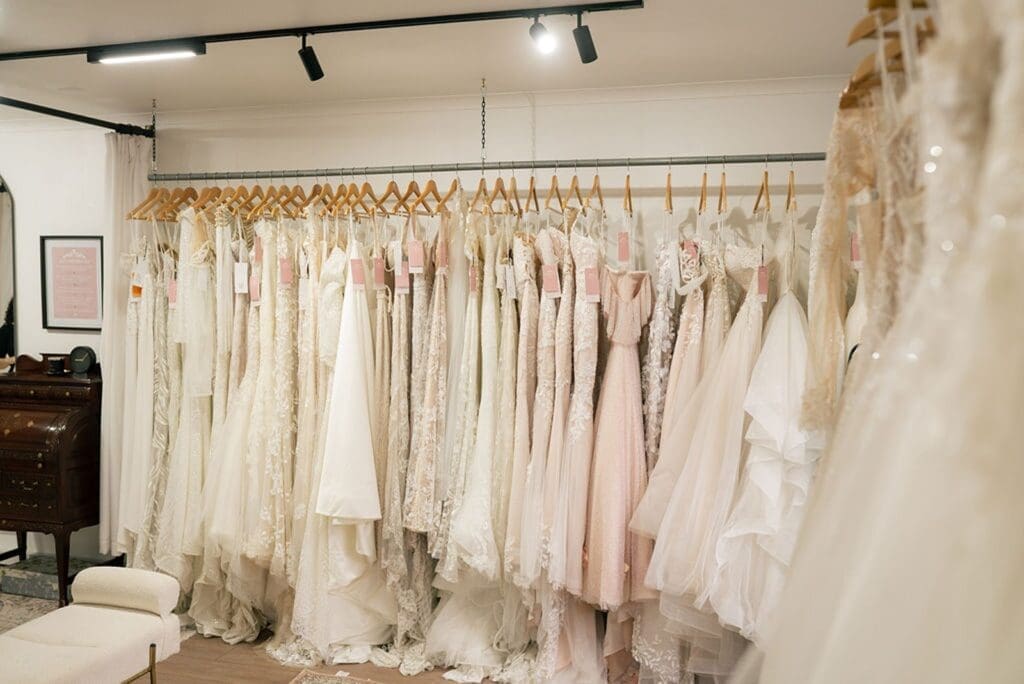 Railing of bespoke wedding dresses and pre-loved wedding dresses at Meliza Mary