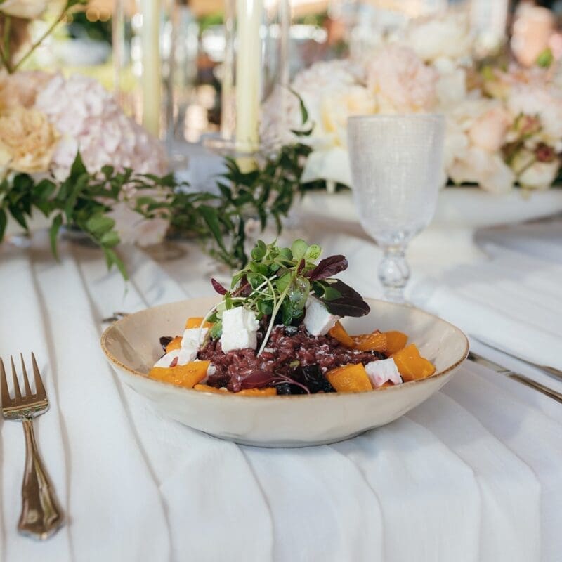 Plated wedding meal on white table cloth by Hamblins Catering